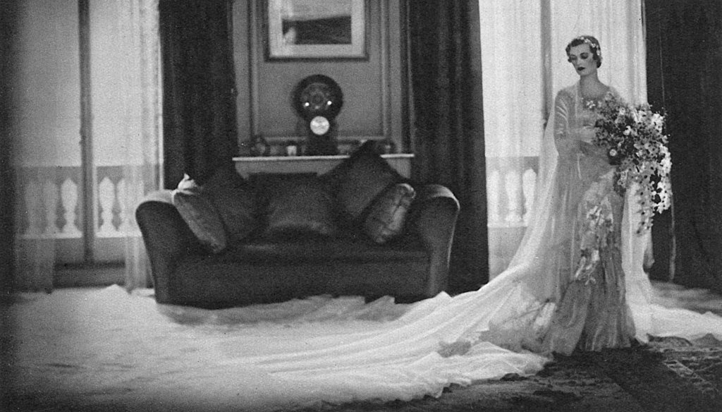Embroidered_silk_satin_wedding_dress_designed_by_Norman_Hartnell_1933_Given_and_worn_by_Margaret_Duchess_of_Argyll_cIllustrated_London_News_Ltd-Mary_Evans